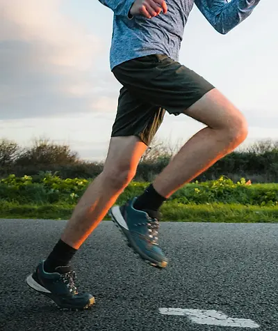 Close up of man's legs and shoes while running